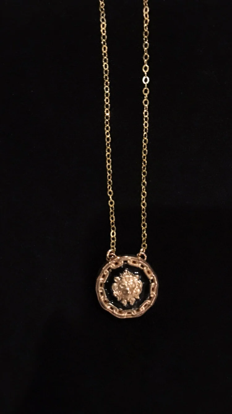 small blk chanel lion on blk.JPG