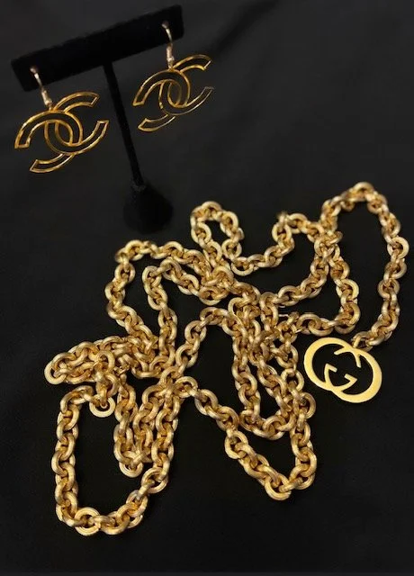 gucci with gold earrings.jpg