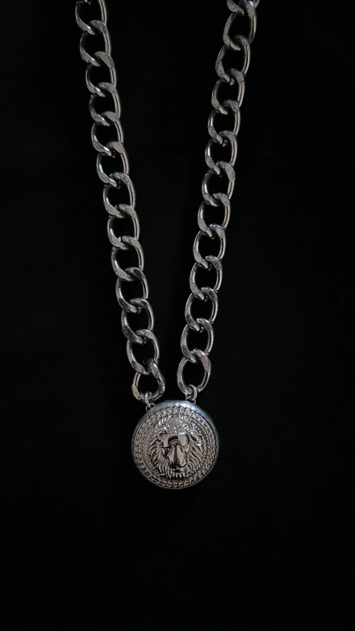 silver lion on ch chain on blk.JPG
