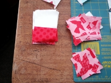I especially like the Churn Dash block so using some additional fabrics from the Kiss Kiss fabric collection by Abi hall, I fussy cut some lovebirds for my center squares, then used Lipstick Dots and Cloud dots to create the needed units for my churn dash blocks.