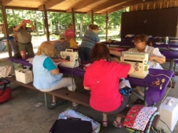 These volunteers took their sewing skills to the great outdoors for this "Campground Sew-A-Thon"