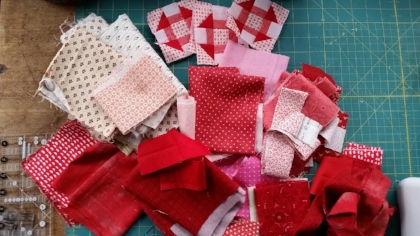For Valentine's I am starting with a pile of pinks, reds and some lights for background in my blocks. Look at all that delicious Moda Fabric! This mini would be charming made up in brights, low volume, civil war, ....almost any fabric that makes your quilter's heart happy♥ You'll need to make some Half Square Triangles (HSTs) for your mini Churn Dash blocks. In this tutorial I will showcase using the Creative Grids 4 in 1 Half Square Triangle Ruler CGRBH1 to make my HSTs......But you can create your your HST using any method you like for your little quilt. As long as they will finish to 1" x 1" size .
