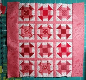 Add the 2 1/2" border strips to the sides, press towards the border