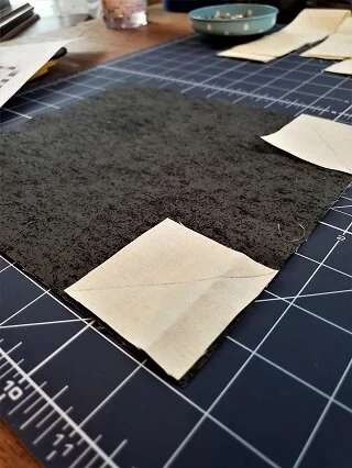 This big block goes together quickly using the pre-cut mini charm squares. A few sew and flip corners & a dozen seams later and your buggy and background are complete. Finish off with an applique triangle on your buggy. So cute!