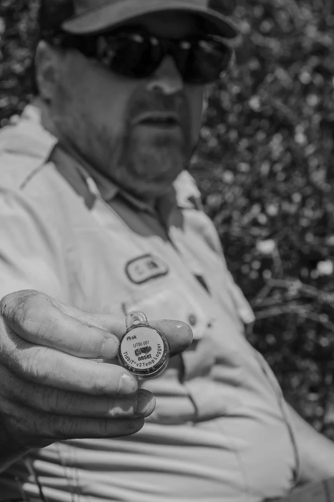 Chris Kennedy of the US Fish and Wildlife Service shows a water monitoring device. Colorado.