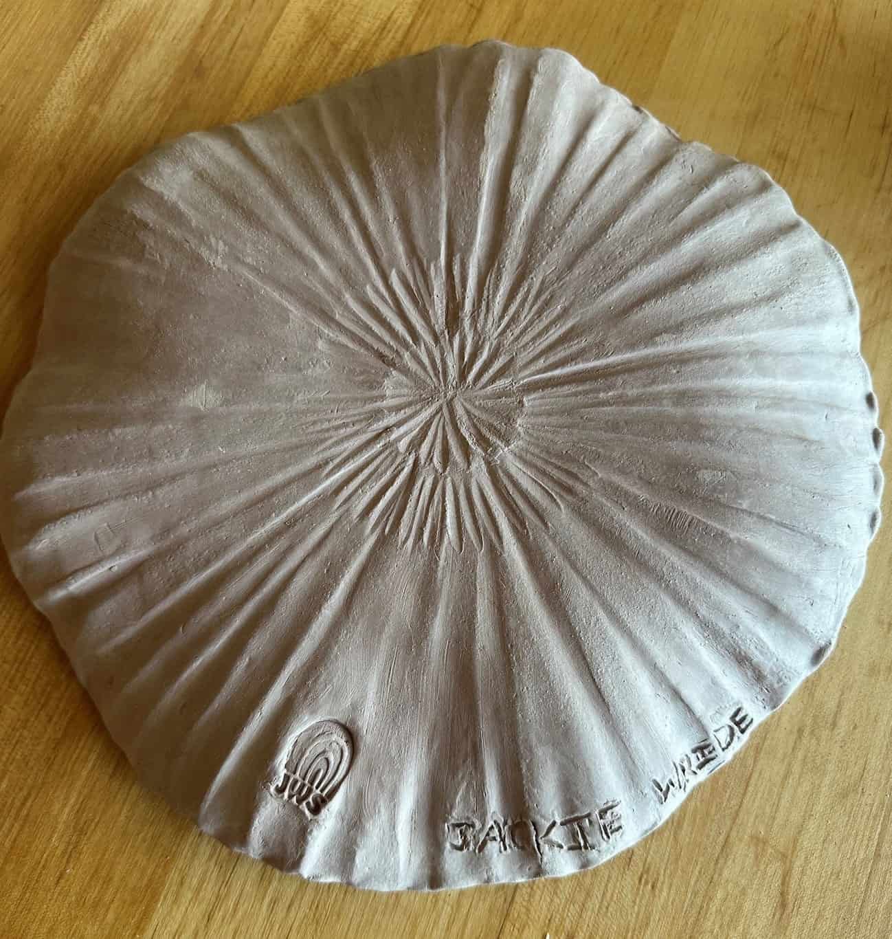Appetizer plate bottom lots of movement Brown stoneware_1.jpg