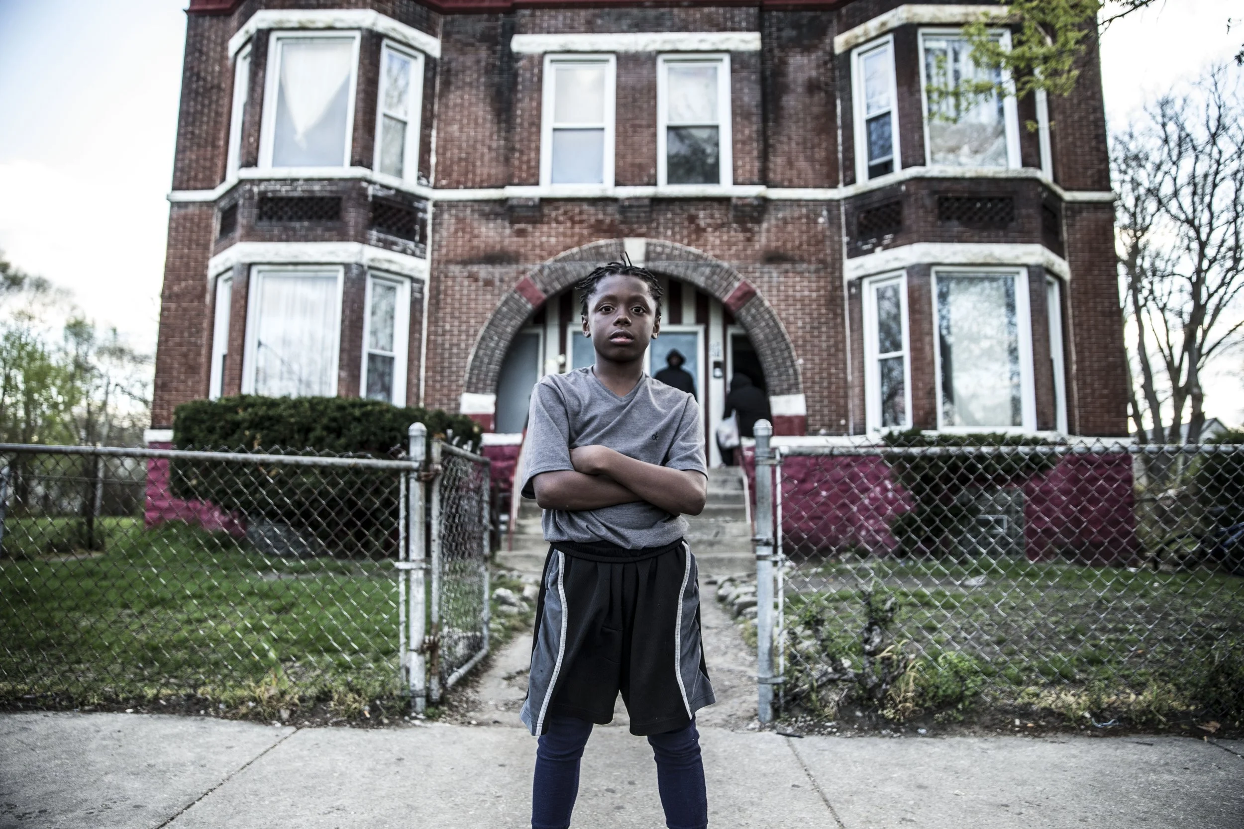 Boy in front of home, Southside Chicago