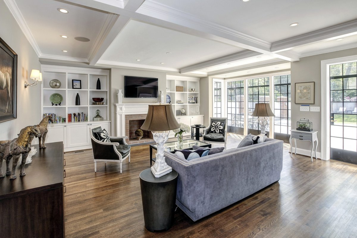 the-family-room-has-a-wall-of-sunny-windows-overlooking-the-garden-out-back.jpg