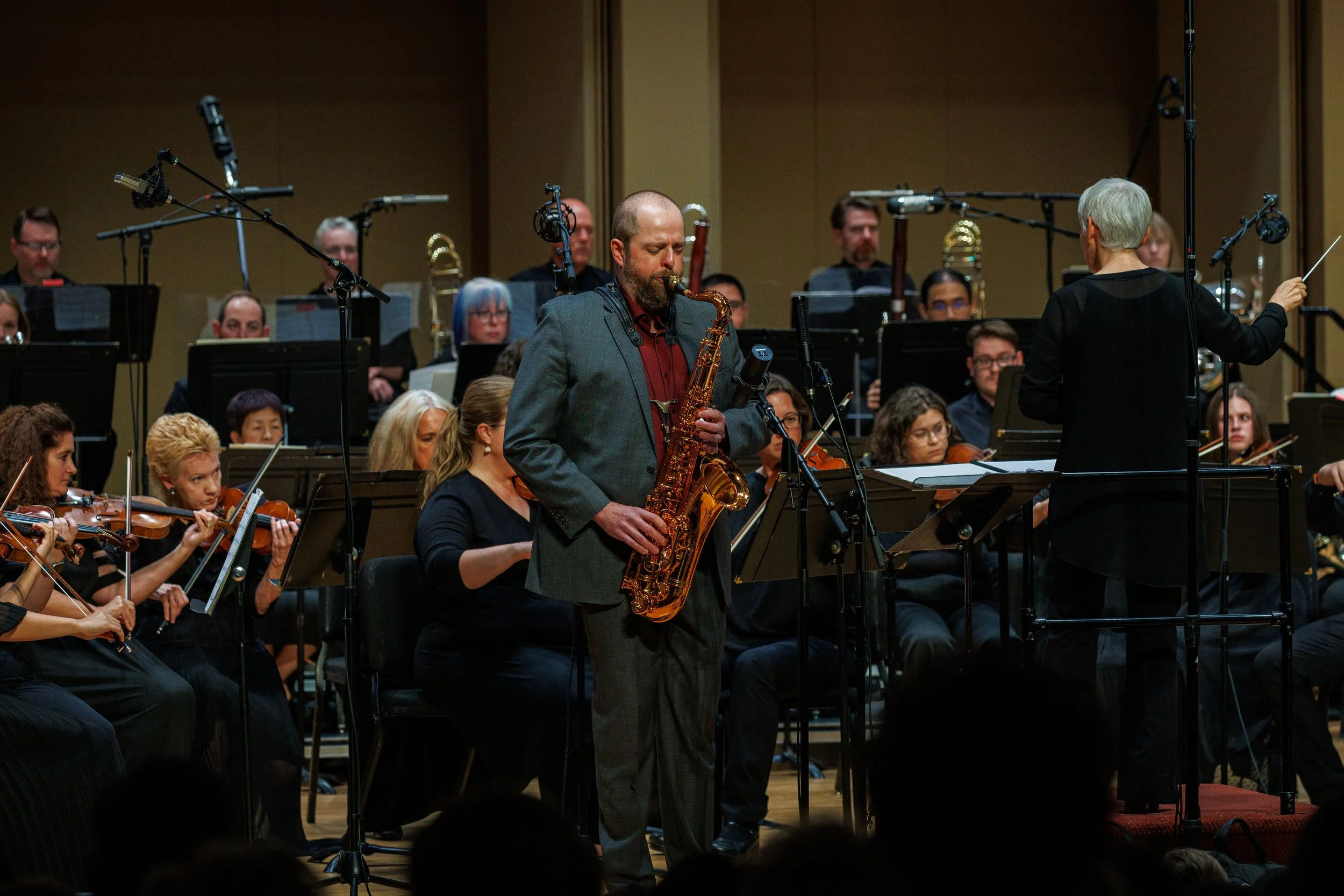 Jon Armstrong on tenor saxophone, soloing with orchestra