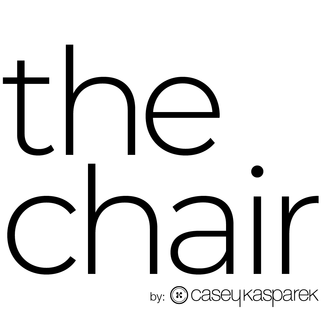 Product headline for  'The Chair' by Casey Kasparek, with large black text on a white background and small text at the bottom.