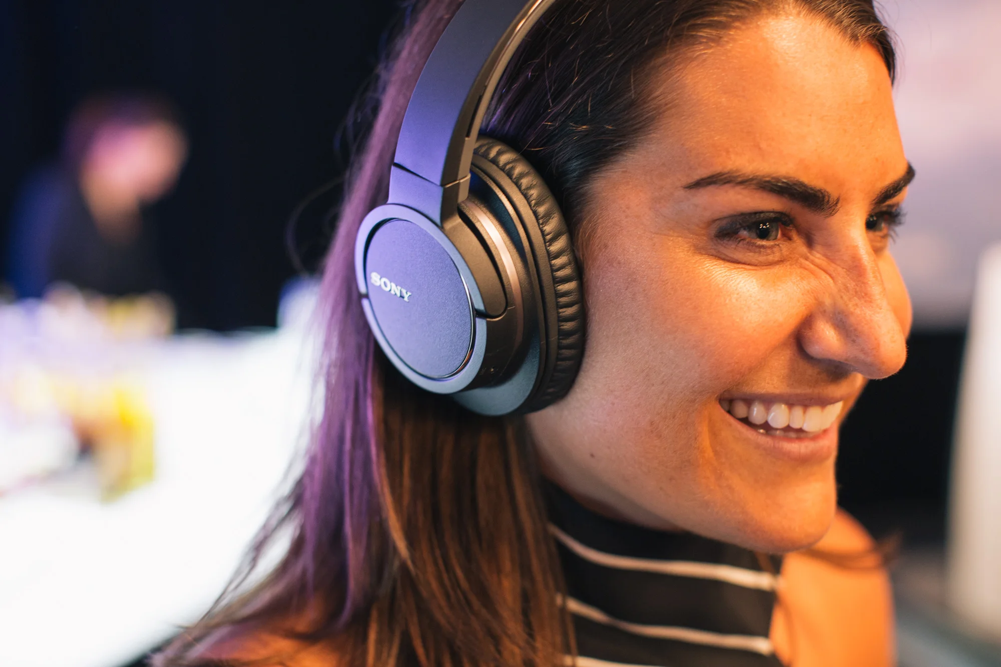 Attendee trying on headphones. (Copy)