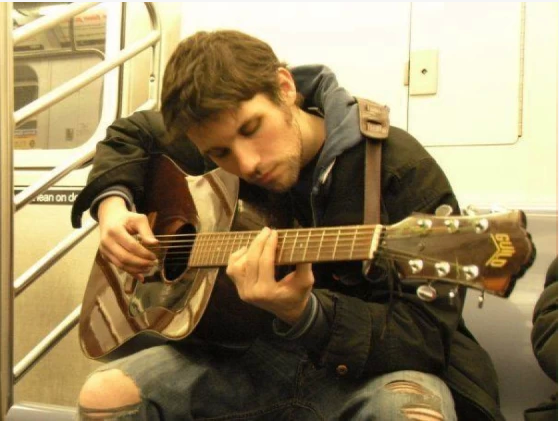 Playing Guitar on Subway .png
