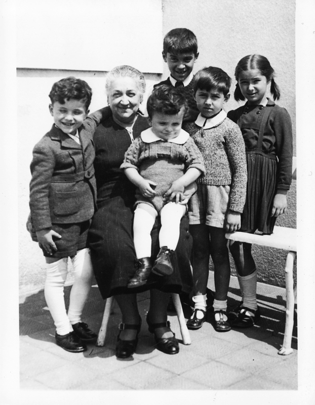 Majka Mara with her grandchildren (my cousins) c.1940 Antonije, Misa (on lap), Fedja, Bacika, Maya
