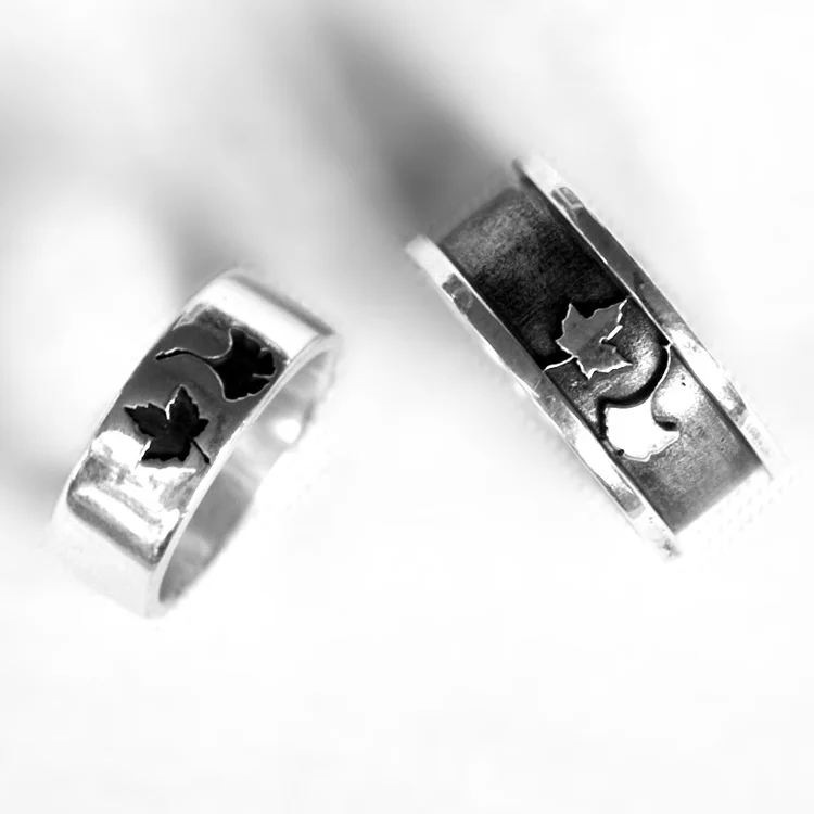 These sterling silver custom wedding bands were designed in collaboration with the couple, Grace and Jim, and Mo Gambill of Momentous Jewelry . 