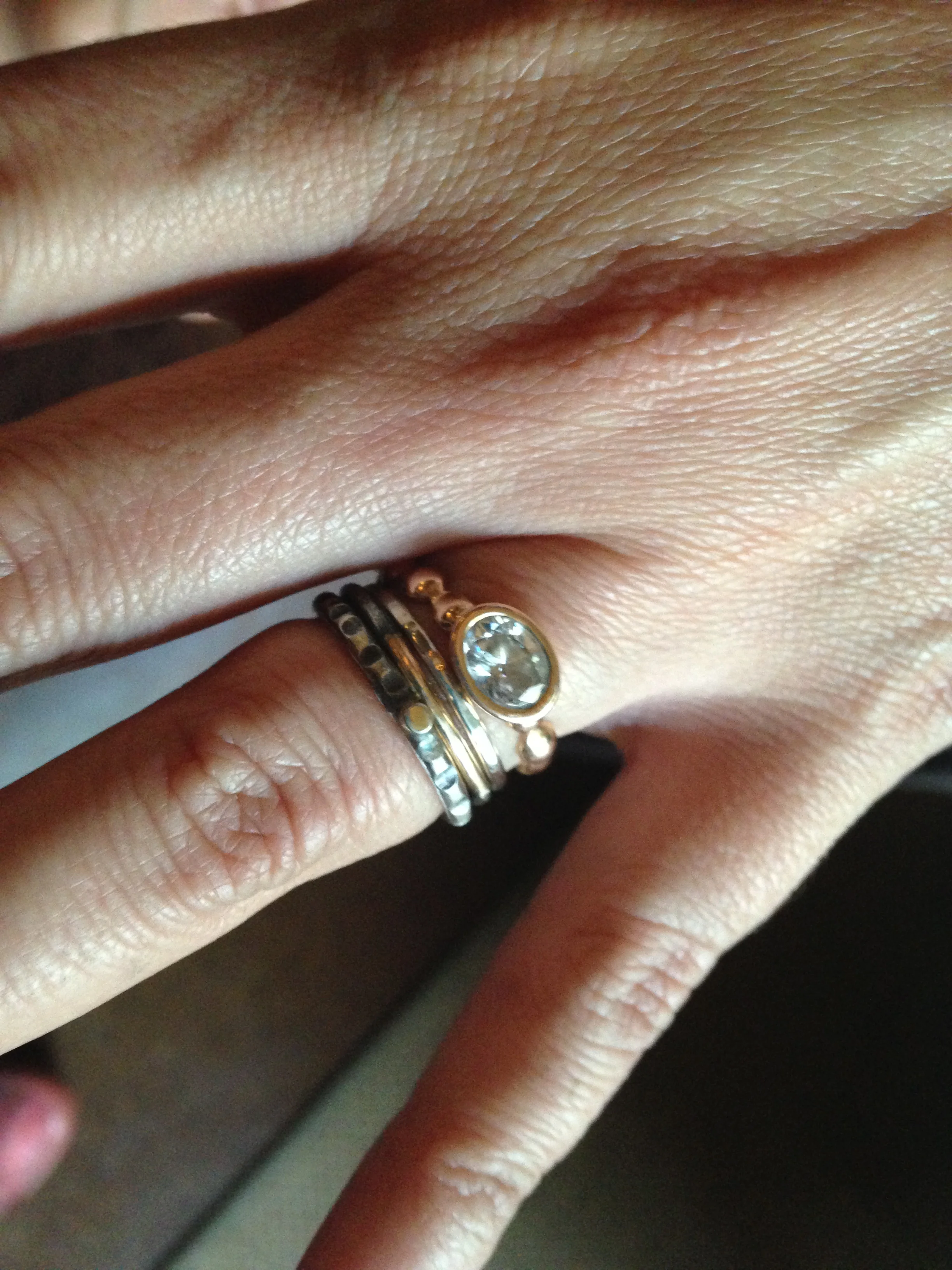 carla's engagement ring (made by another jeweler) + stacking wedding bands. lovely contrast of the rose gold w/oxidized silver + yellow gold. 