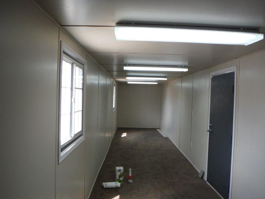 40' High Cube container converted to an office with lighting door windows insulation and flooring