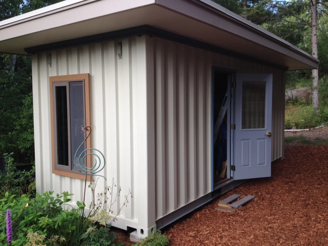 Container shed blends into the property.jpg