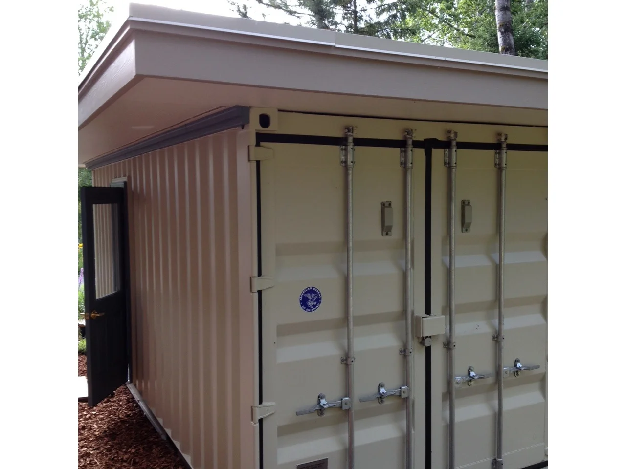 Container shed with roof and man-door.jpg