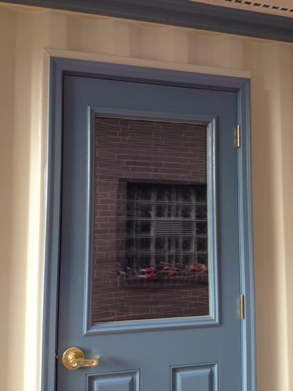 Man-door and container painted to blend in with the house.jpg