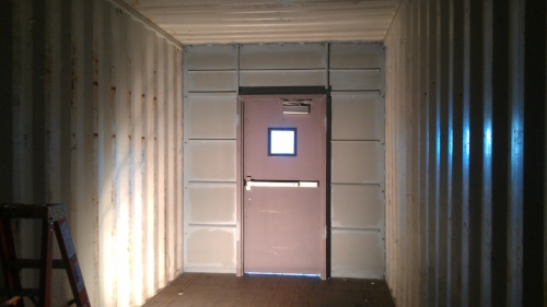 Partition in container with a door