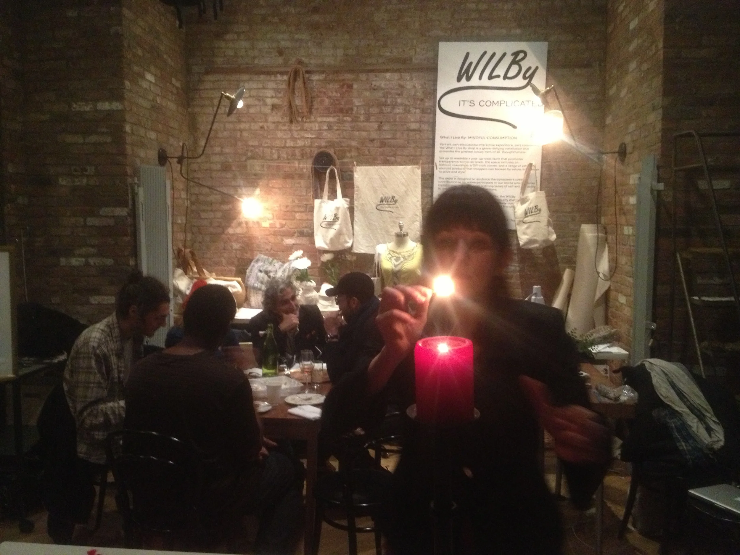 The amazing Jen DeNike prepares her Tarot workshop as our first WILBy family dinner goes on behind her. Magic.