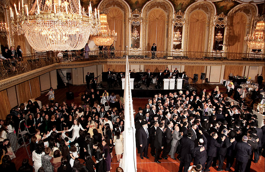 The dancing itself is your typical hora-style circle dancing with a bit of a twist. The bride/groom/parents usually hover at the center, pulling in close friends and family to whirl around with.