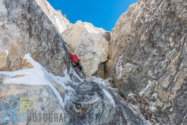 Chris Thomas navigating the first roof on P3.