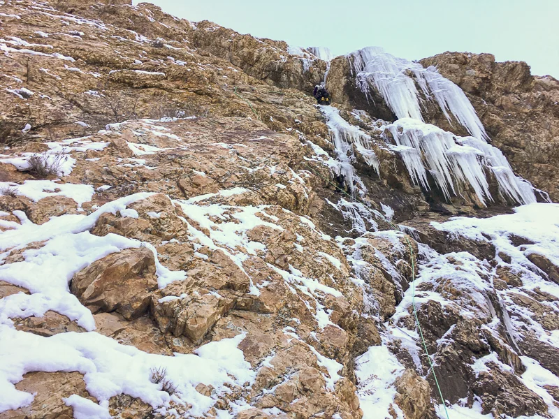 Nikki Smith reaching the ice in the chimney of Storm Mountain Left Chimney . Photo ©Tom Adams