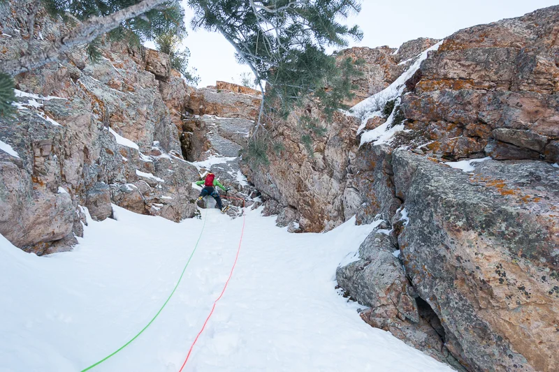 Jake quickly made his way up, frozen from having endured too long of a belay as I tried to figure out the moves on pitch 1. Taking the rack, Jake started up the steep pitch 2, a series of overhanging stacked chockstones in a wide chimney.
