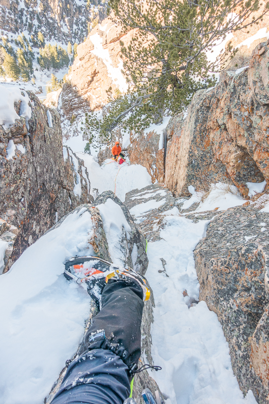 Looking down at Jake with another 30’ to go to the anchors. Jake psyched I brought a second jacket for us to trade out wearing at the cold belays. It was in the 60’s in town, but freezing on the mountain.