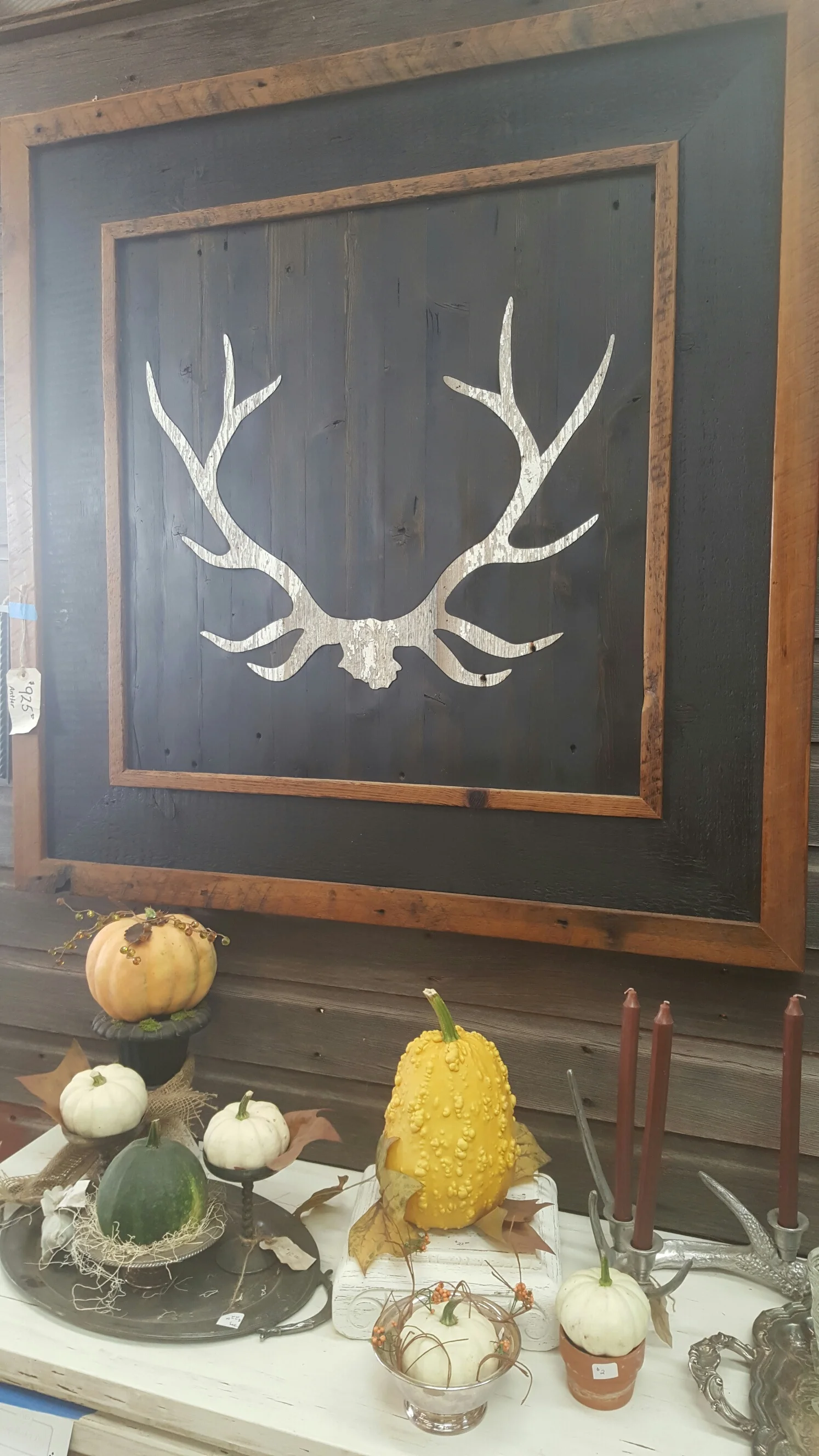 A simple rendition of antlerson wood panel would compliment any rustic or transitional space