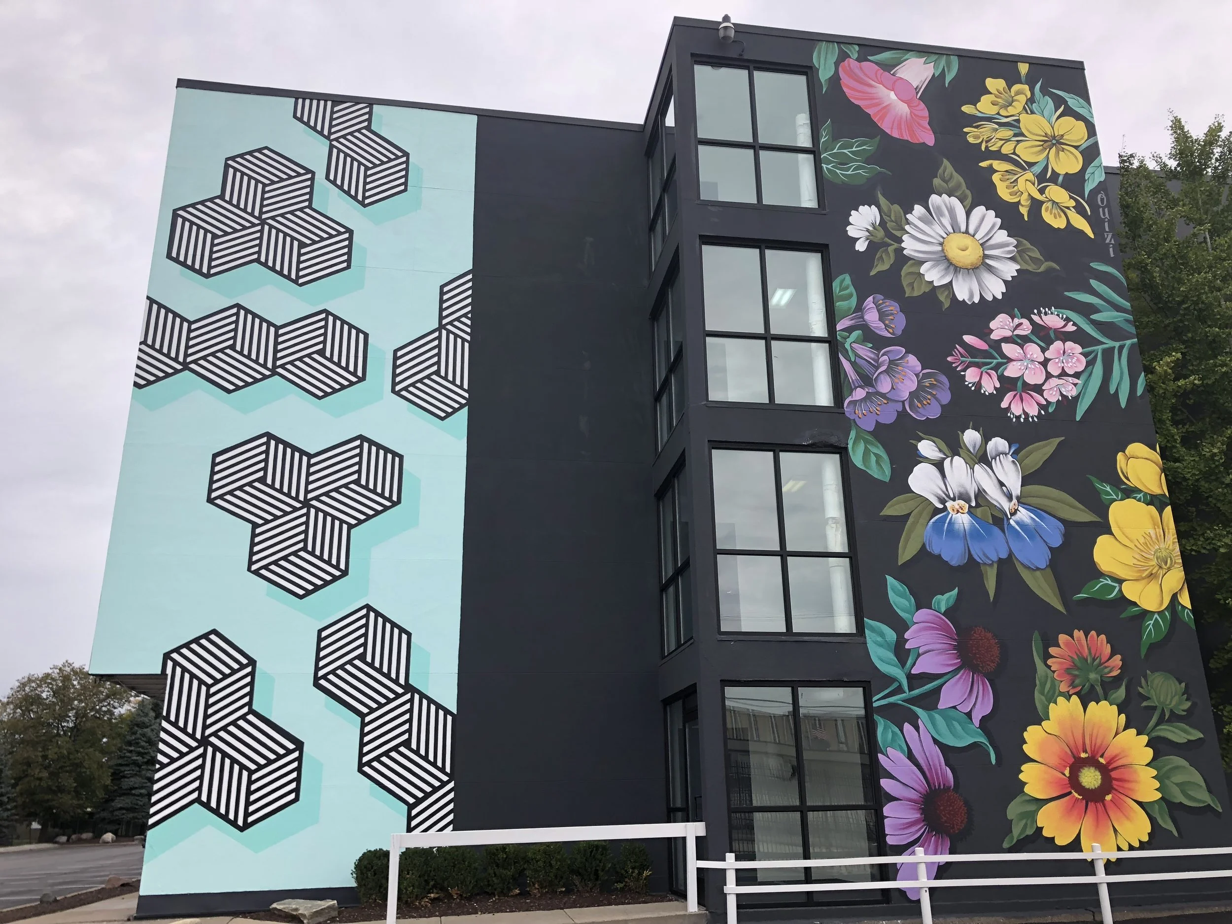 Outdoor wall murals created by Michelle Tanguay and Ouizi.