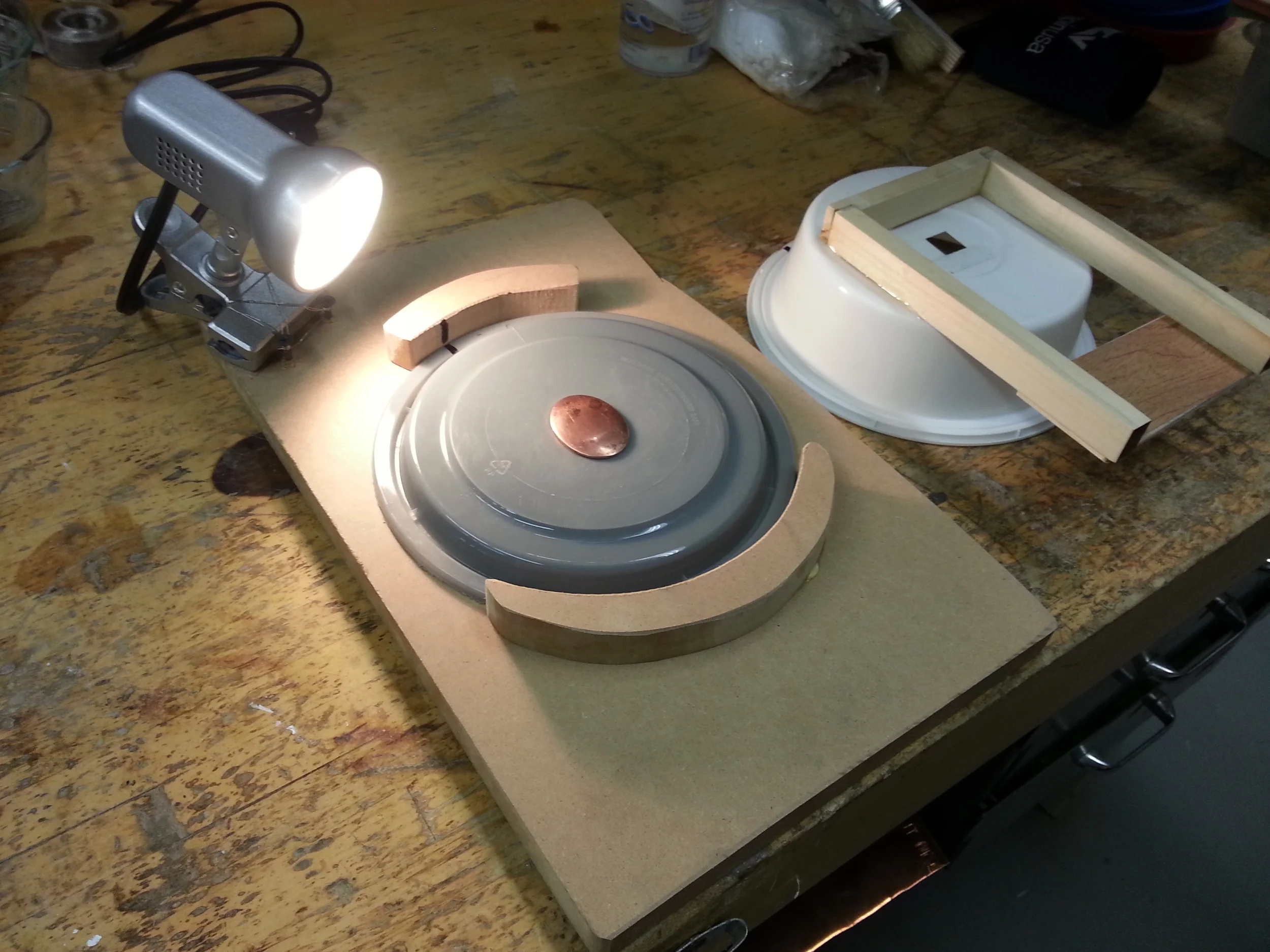 I line up the markings and put the piece on the outlined oval (I'm working with multiple pieces of the same size/shape) to make for consistent images and easier compiling.