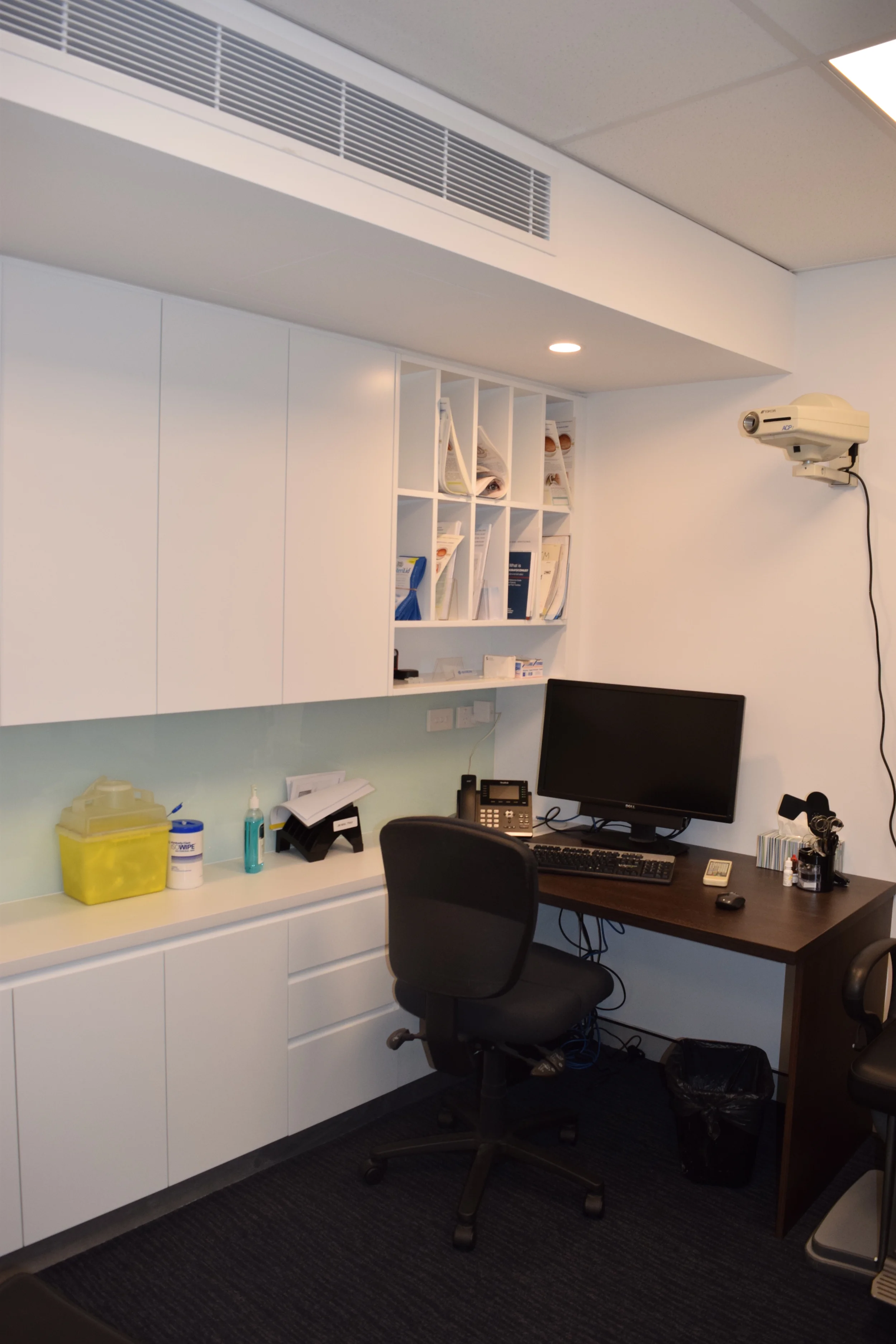  Typical consult room with ample storage and fixed joinery. 