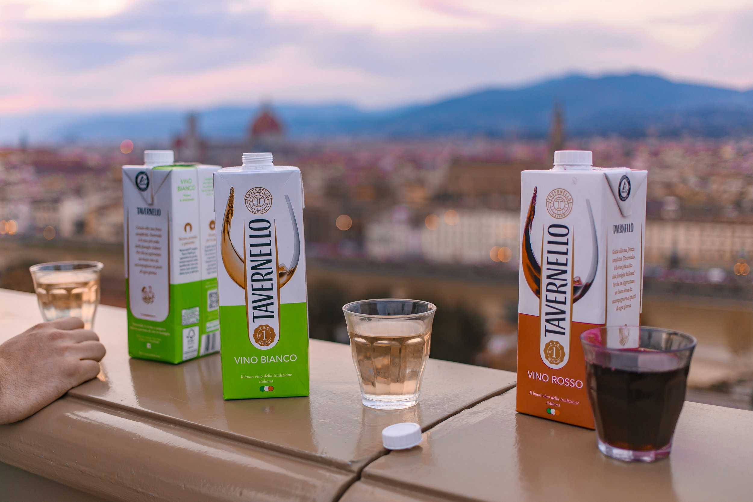  Watching the sunset with snacks and drinks at Piazzale Michelangelo, one of the best things to do in Florence!  