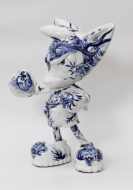 Hand-painted Pjipje sculptures created by Anna Sokolova for the Loes van Delft collaboration, featuring original Contemporary Delft Blue-inspired illustrations on collectible designer figures.