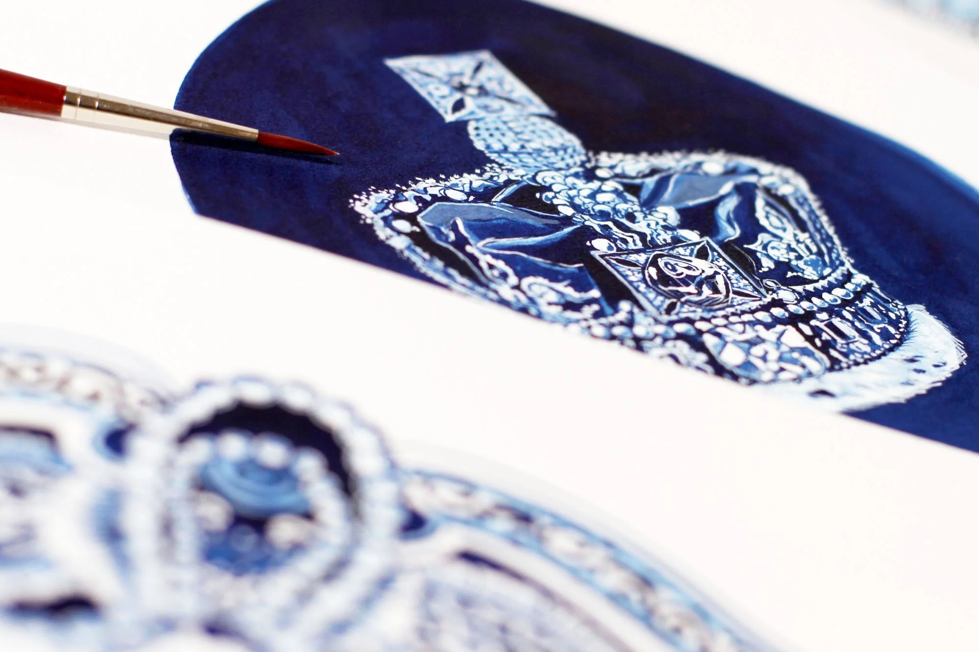 Close-up of painting process showing detailed crown jewel rendering in blue watercolor and gouache for The Crown Netflix inspired artwork.