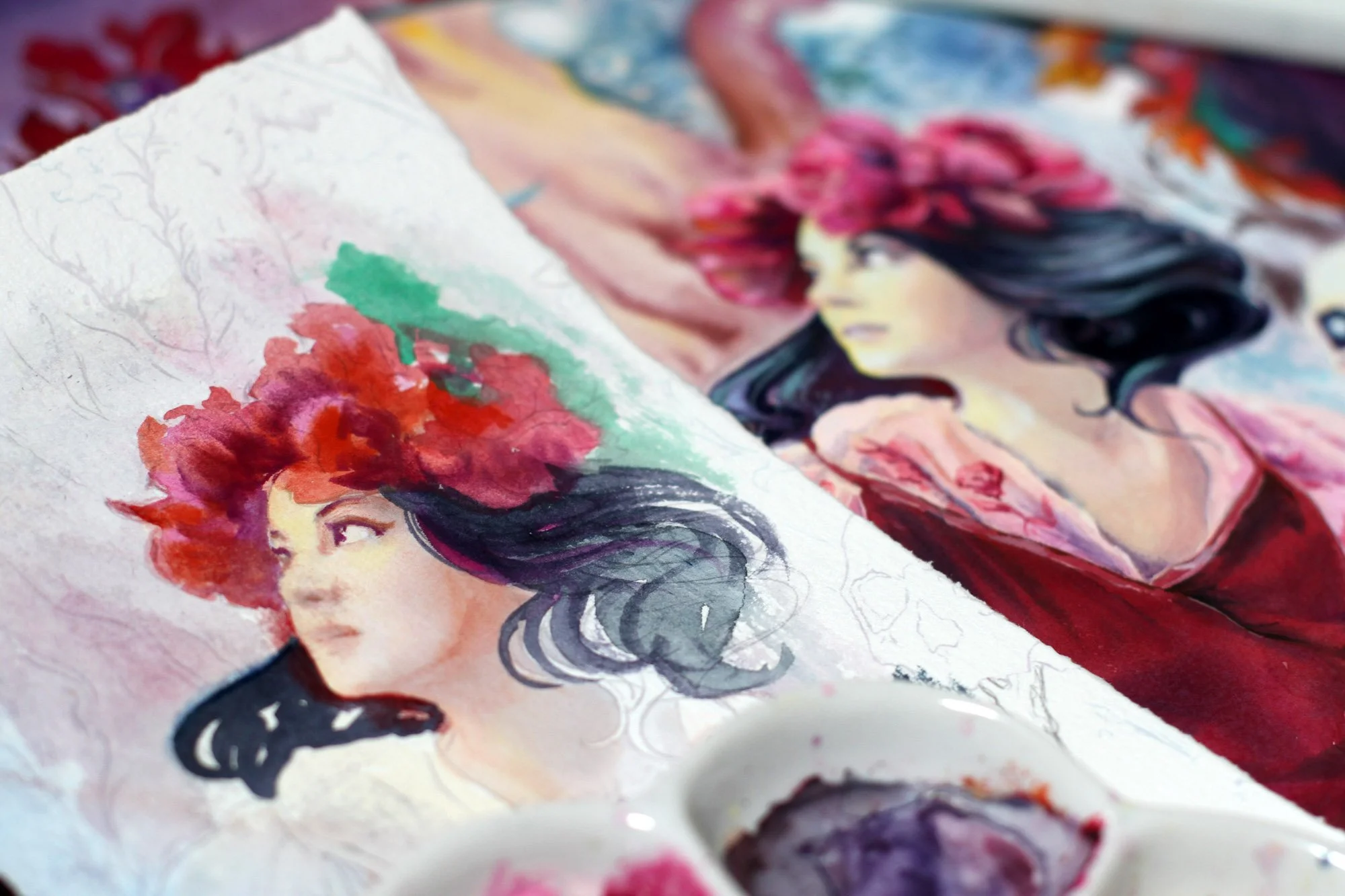Process photo of Anna Sokolova’s Vasilisa the Beautiful artwork in progress, showing the painted fairy-tale heroine with a glowing skull lantern, surrounded by watercolor palettes and mixed-media materials.
