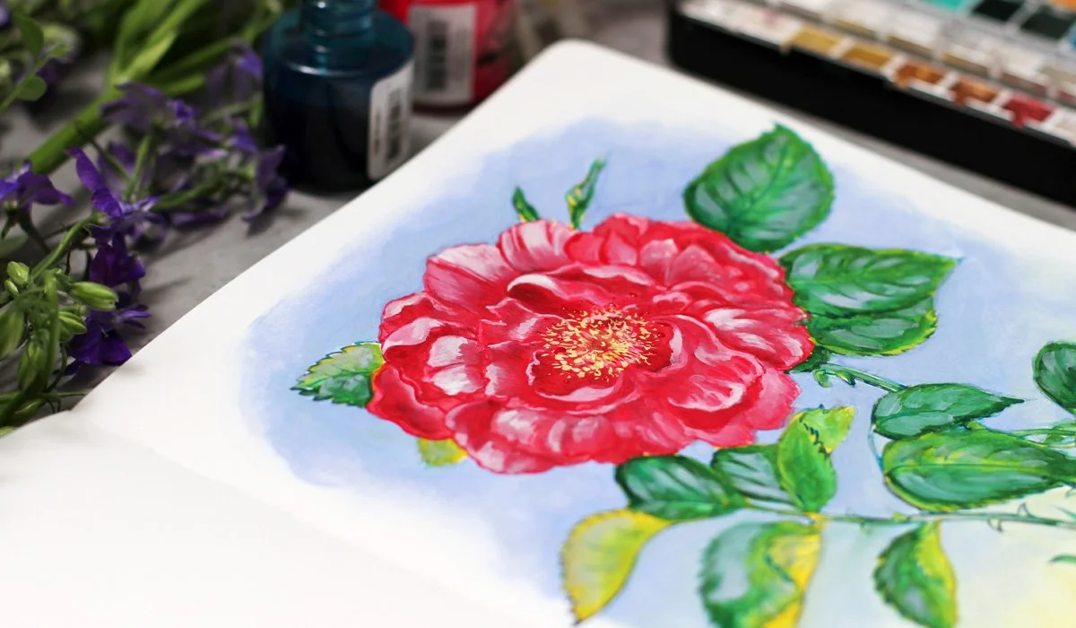 Watercolor Rose painted with ink and aquarelle in cotton sketchbook
