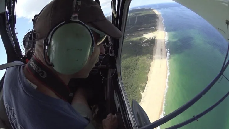 Pilot spots sharks from above to save surfers