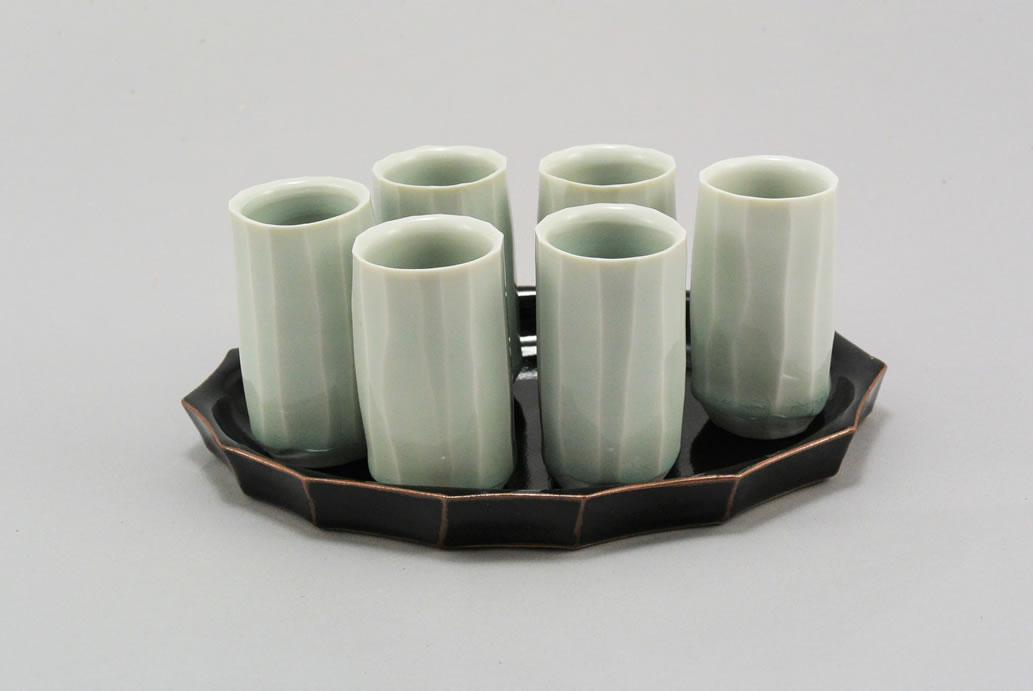 Group of porcelain sake cups on a tray by Barry Krzywicki.jpg