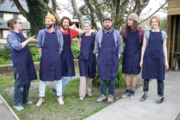 Potters Kat Wheeler, Matt Foster, Lawrence Eastwood, Britta James, Roelof Uys, Carson Culp and Shannon Bartlett-Smith in their new (at the time!) Leach Pottery aprons