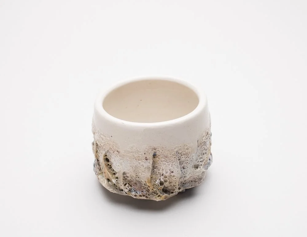 textured yunomi with smooth white glaze and textured effect on the bottom half