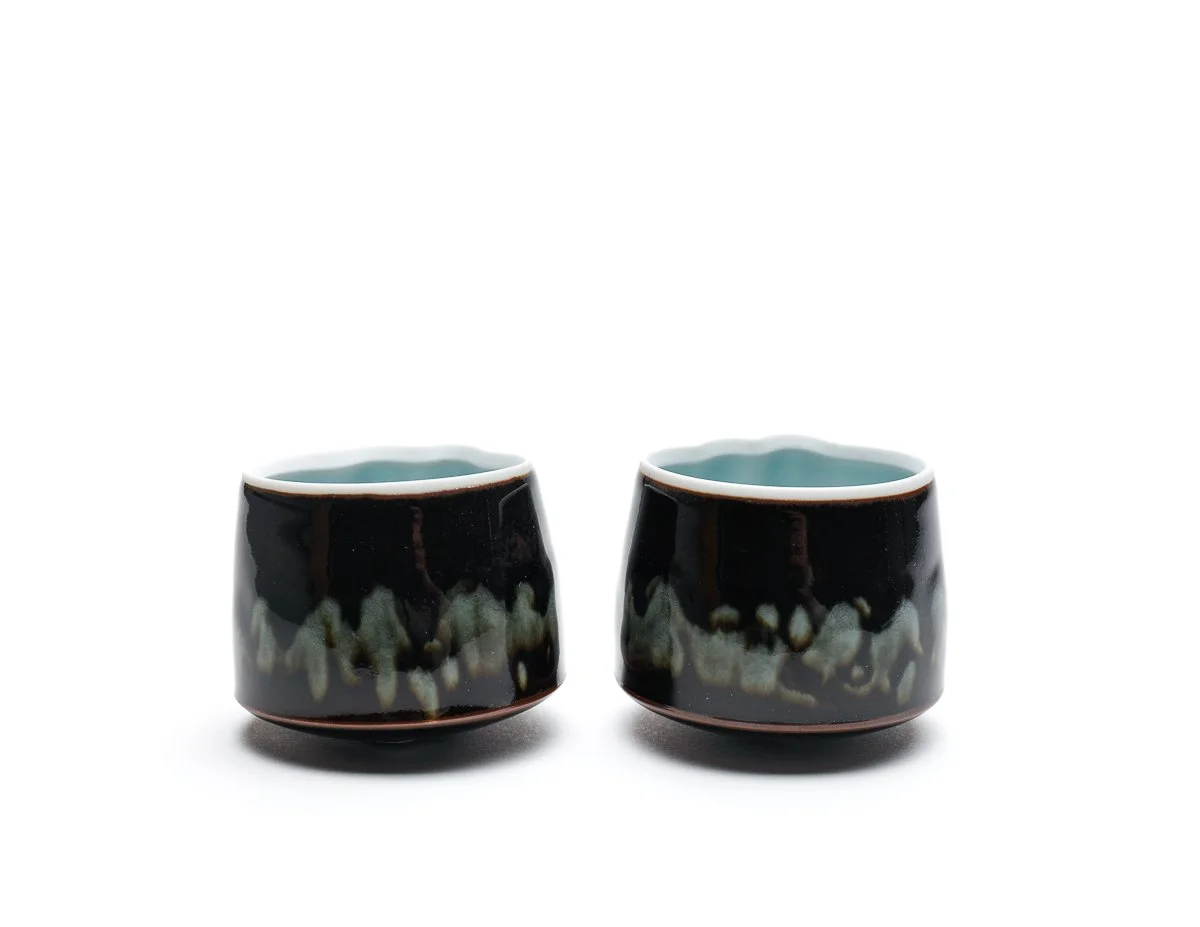 A Pair of Small Tenmoku and Celadon Cloud Cups, CK386