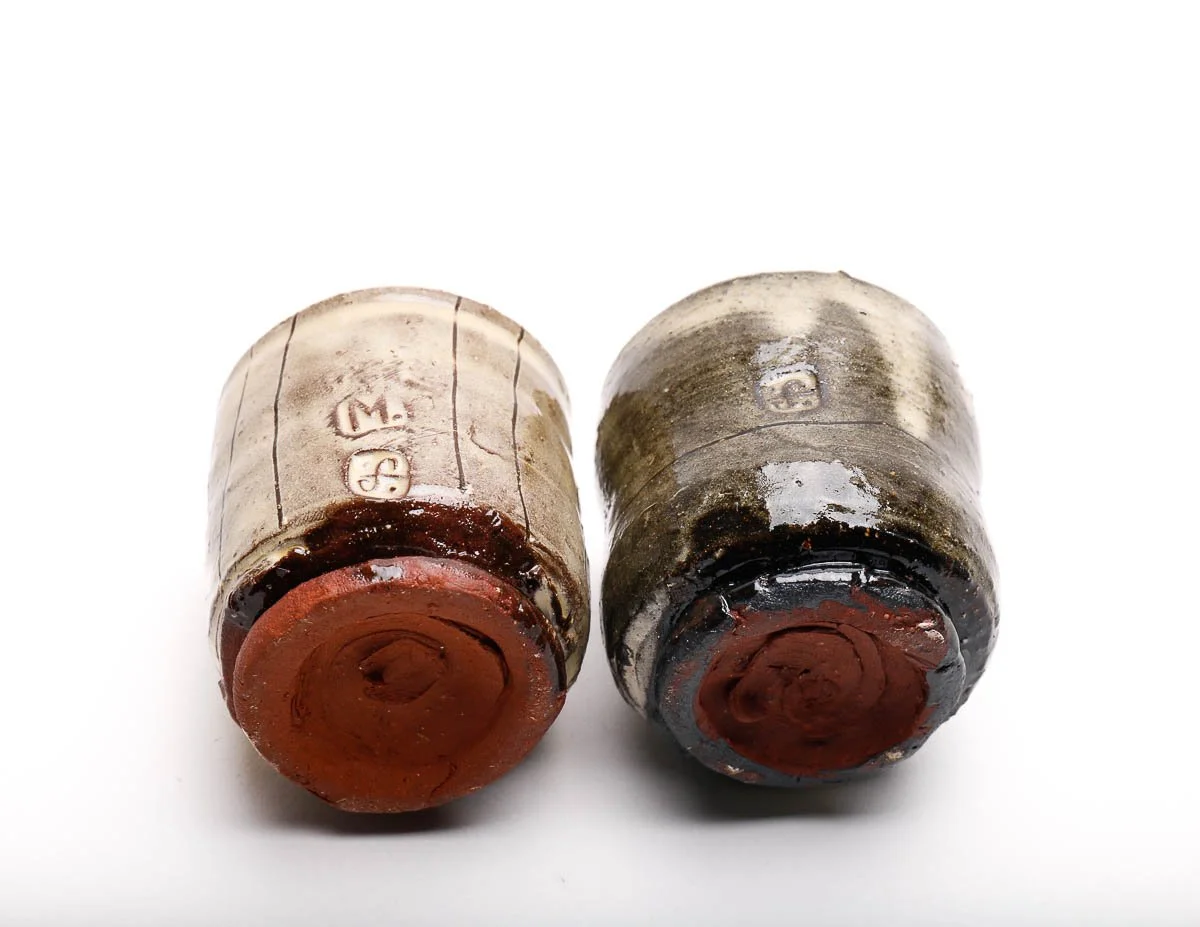 A Guinomi. handcrafted ceramic tea cup commonly used in Japanese tea ceremonies. yellow glaze with dark patterns