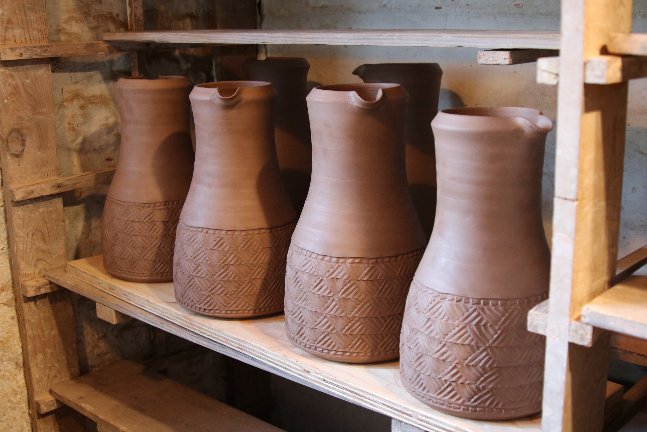 Thrown jugs drying