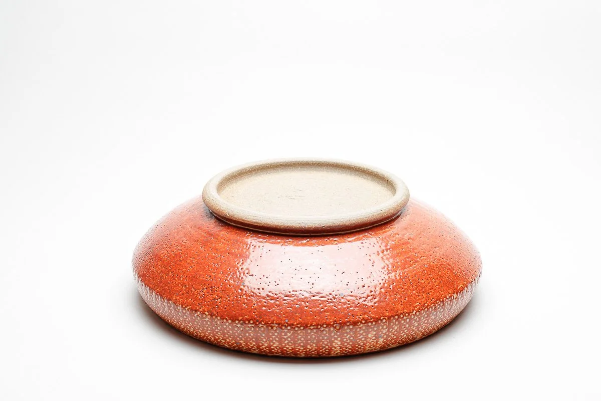 Large shallow bowl with shino glaze with patterned edge