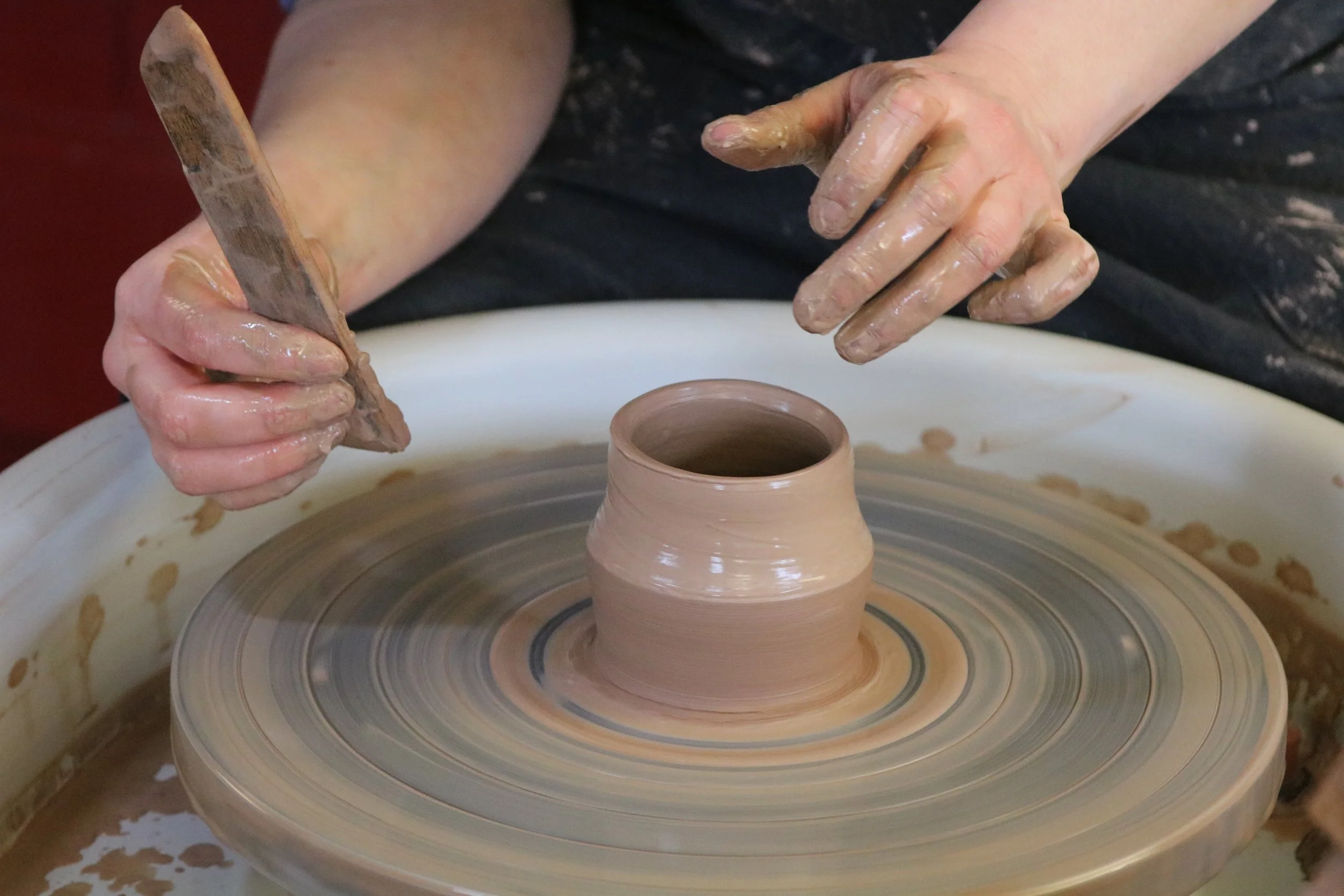 Potter making a teacup
