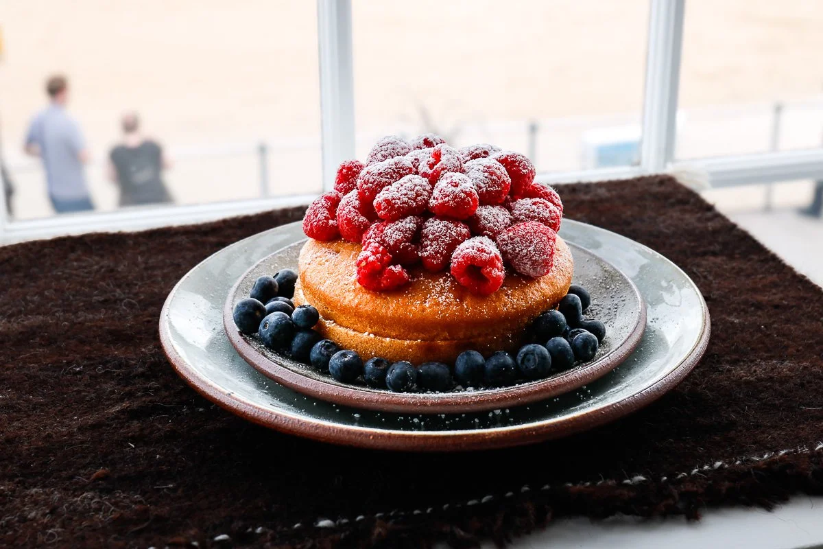 Standard ware dinner plate in dolomite glaze, displaying a cake