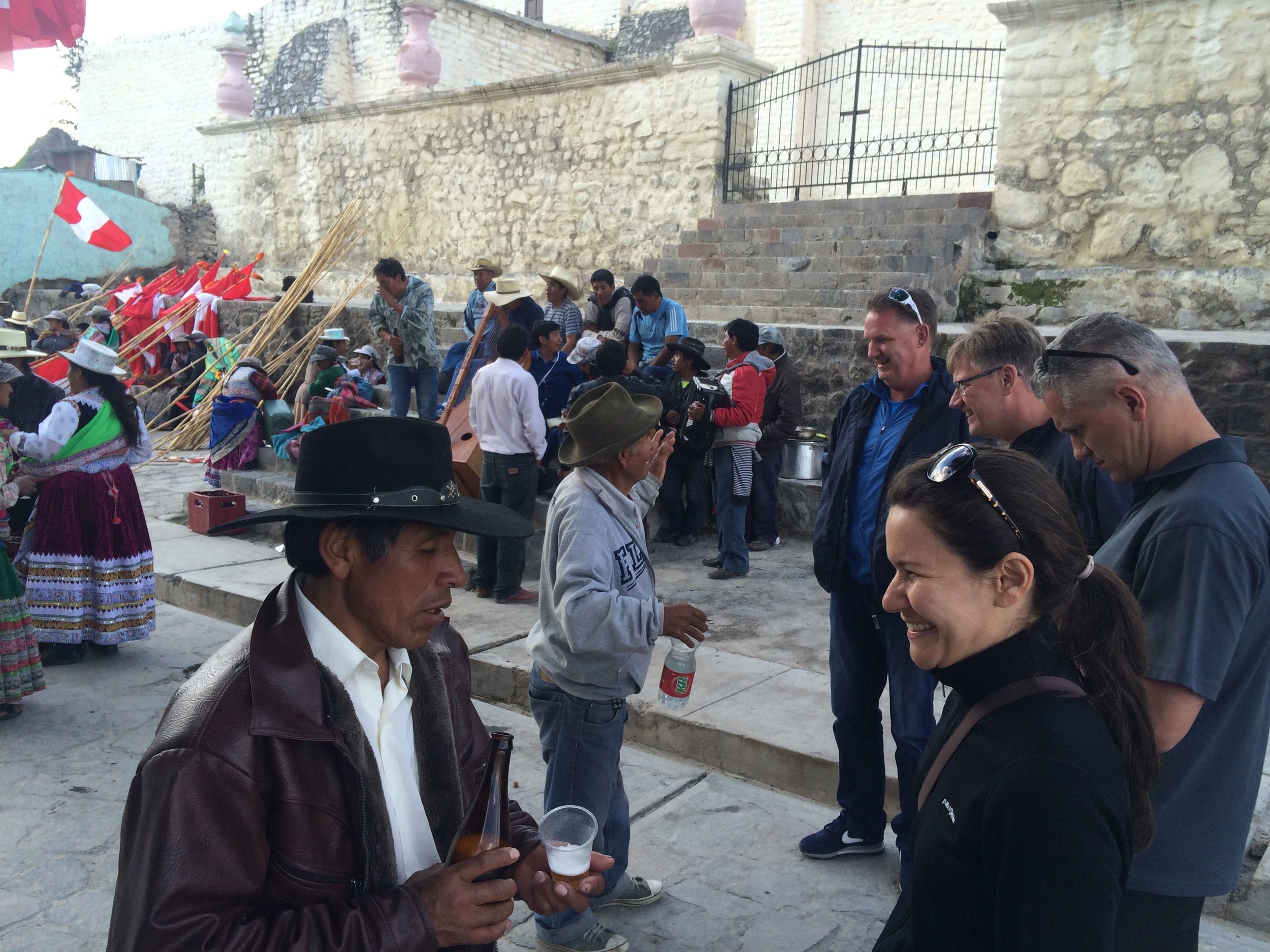  A resident of Maca getting a head start on the morrow's festivities, and trying to get E to partake of his alcoholic beverage. A few moments later we all broke out into a dance as locals played traditional music. 